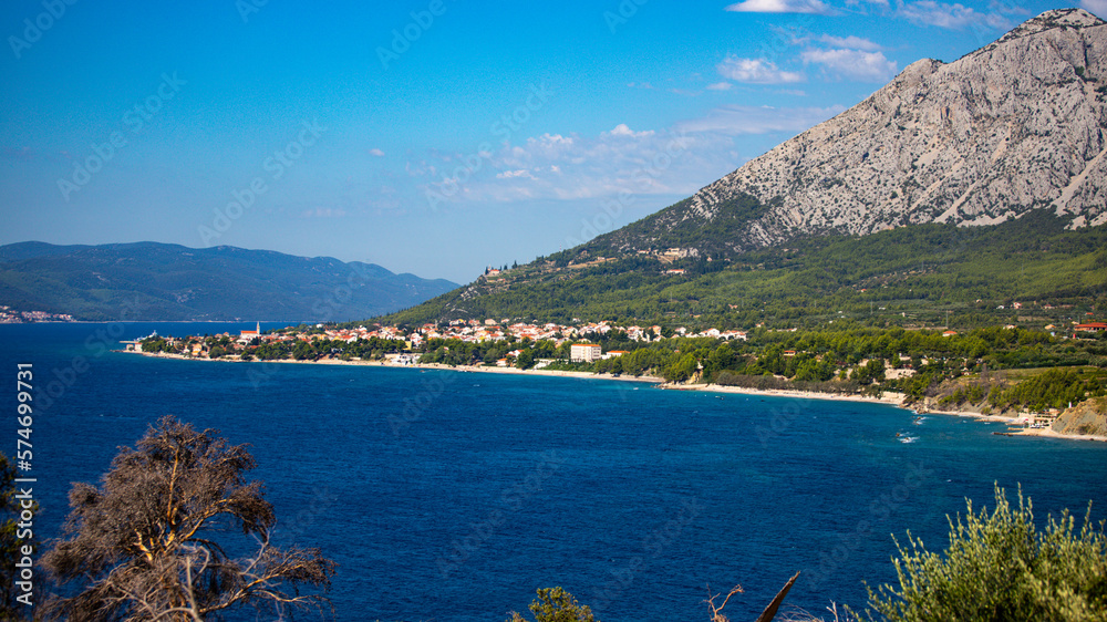 Naklejka premium panorama of the peljesac peninsula coastline in croatia; an amazing Mediterranean coastline with rocks and green hills over turquoise water