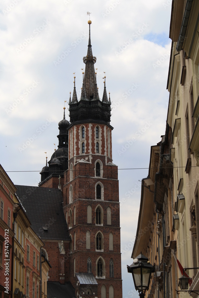 Cracow, Poland. Streets and old tenement houses around the old market. Mary's Basilica tower.
