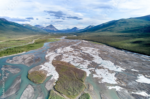 Aerial drone image of Fresh July Snow on the braided looking Dietrich River between the Coldfoot Camp and Prudhoe bay in Alaska with the Trans-Alaska Oil Pipeline photo