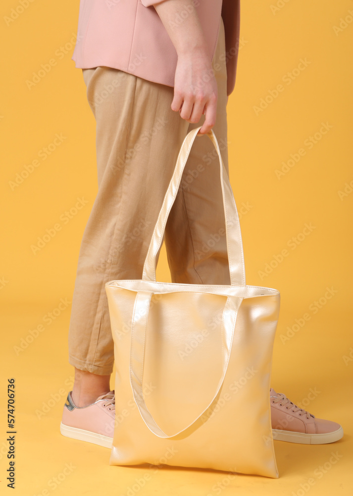faux leather white shopper bag close up photo with model legs faux leather white shopper bag close up photo with model legs