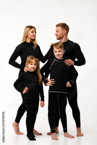 Sports family in thermal clothes, on a white background.