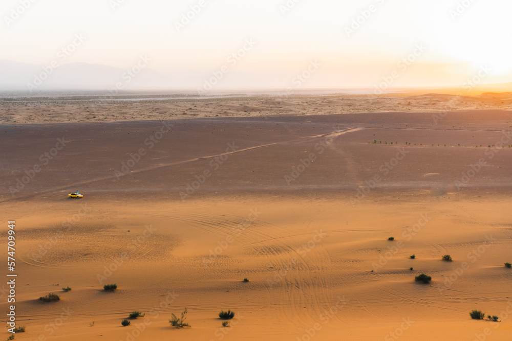 Beautiful orange sunset panorama in middle east desert. Iran. Kashan deserts. Taxi tours and popular destination