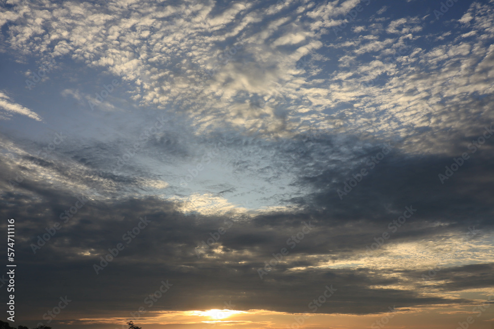 white clouds and sun against a background of blue sky white clouds and sun against a background of blue sky