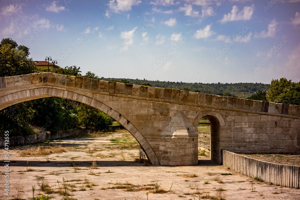 The ancient Humpback bridge, Harmanli, Bulgaria, sunny scenery, travel photograph, partial view The ancient Humpback bridge, Harmanli, Bulgaria, sunny scenery, travel photograph, partial view