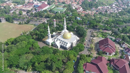 4K footage aerial view of the Baitul Faidzin Grand Mosque at noon in the middle of the central government administration. photo