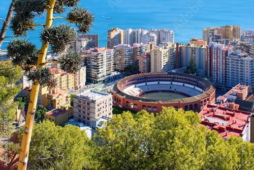 Málaga city view, Andalusia, Spain - city panorama with traditional spanish bullring. photo