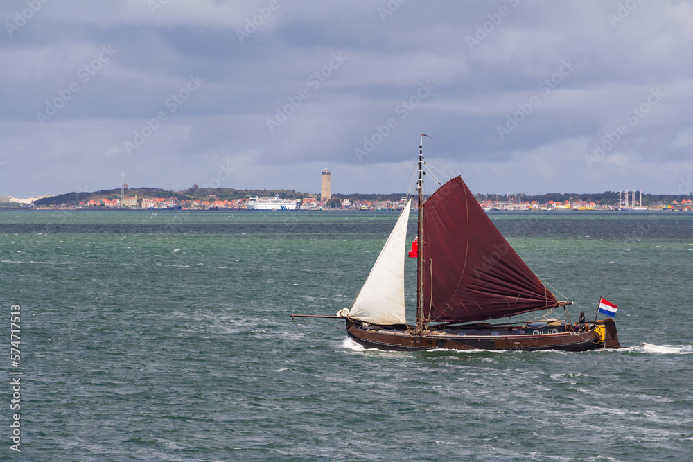 Fototapeta premium Boat passing Waddeen island Terschelling Friesland province in The Netherlands
