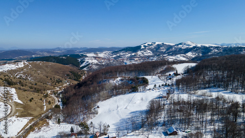 Snow covered mountain aerial view from drone showing spectacular alpine landscape of winter mountain