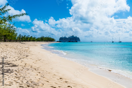 A view up a deserted shoreline of a bay on the island of Grand Turk on a bright sunny morning