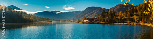High resolution stitched autumn panorama with reflections at the famous Pillersee lake at Saint Ulrich, Tyrol, Austria photo