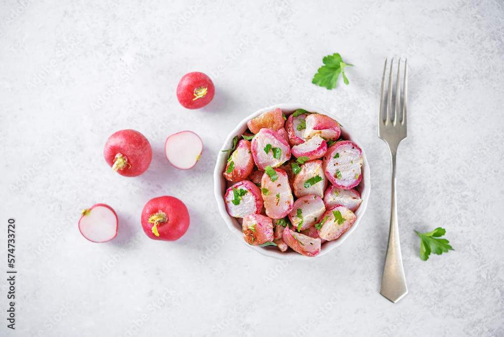 Roasted spiced radish with parsley in a bowl Roasted spiced radish with parsley in a bowl
