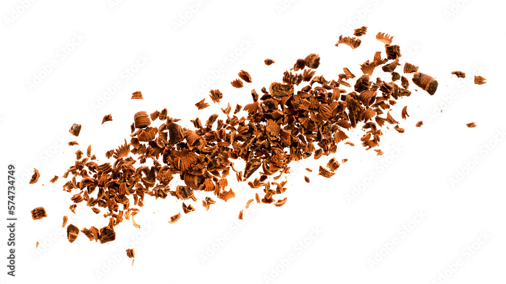 Grated chocolate chips on a white background, top view. Chocolate chips on a white background, top view. Pieces of grated chocolate isolated on white background, top view.