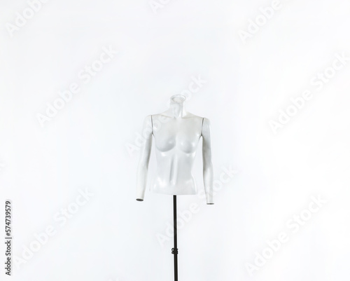 Fashionable white mannequin of headless woman torso with arms over white background (with big copy space)