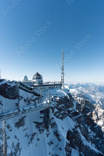 the top of germany aerial view of the snow-covered mountains photographed in winter with bright sunshine and not a single cloud in the sky a place worth seeing in the south of germany © Jan