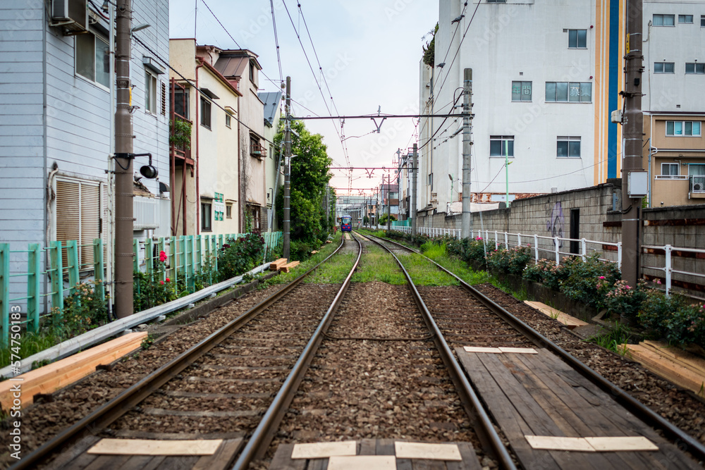 Local trolly train running between homes in Tokyo