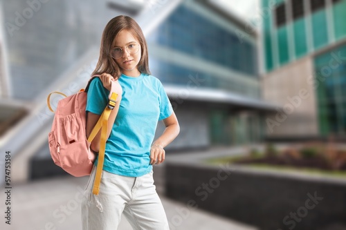 Cute kid with backpack running to school