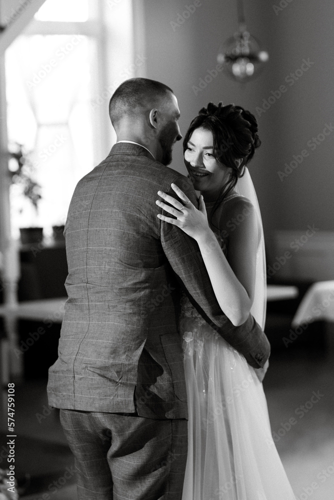 the first dance of the bride and groom inside a restauran the first dance of the bride and groom inside a restauran