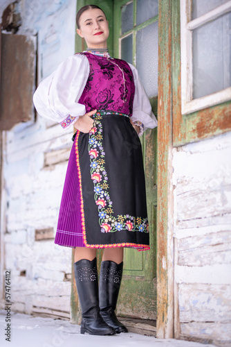 Young beautiful slovak woman in traditional costume. Slovak folklore