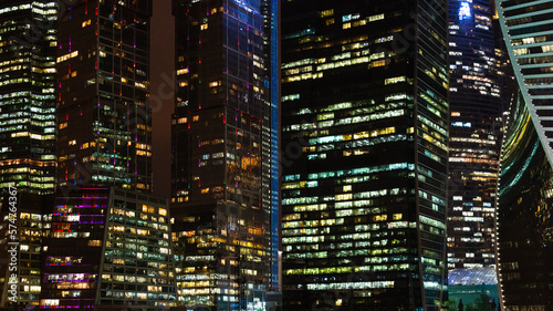 panoramic urban background with of illuminated towers in Moscow city business district in night