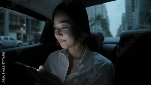 Travel concept of 4k Resolution. Asian women sitting on mobile phones in cars.