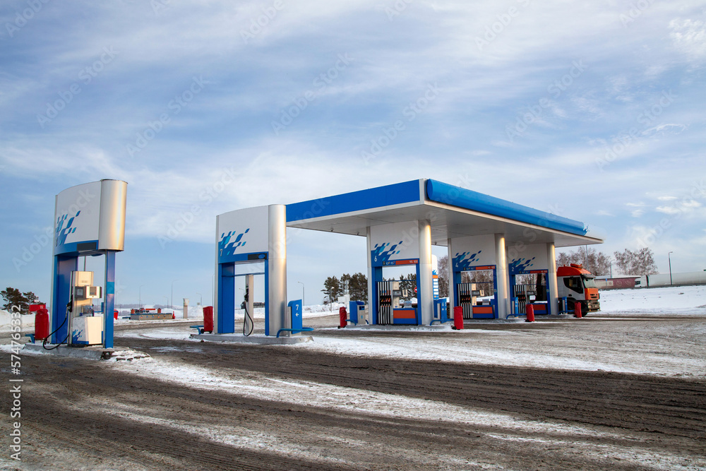 Gas station on a suburban highway. Refueling a truck. Gas station on a suburban highway. Refueling a truck.