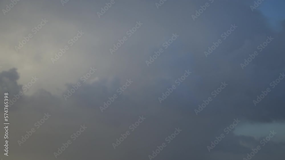 Time-lapse of gray clouds moving across the sky Time-lapse of gray clouds moving across the sky