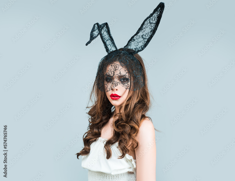 Sexy girl wear easter fluffy bunny ears, isolated studio background