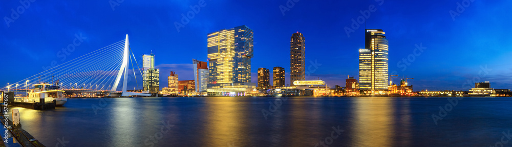 Evening cityscape, panorama, banner - view of Rotterdam with Tower blocks in the Kop van Zuid neighbourhood and Erasmus Bridge, The Netherlands