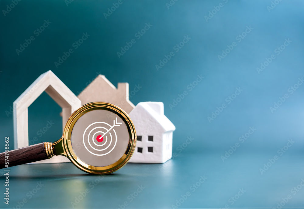 House online search, property survey, buying, selling and real estate concepts. Target icon symbol in magnifying glass lens with many type style of house on blue background with copy space. - obrazy, fototapety, plakaty 