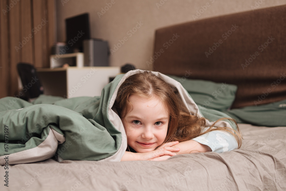 cute and funny girl playing on the bed and having fun cute and funny girl playing on the bed and having fun