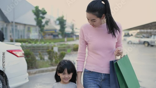 Shopping concepts of 4k Resolution. Asian mother and daughter returning from shopping in the mall.