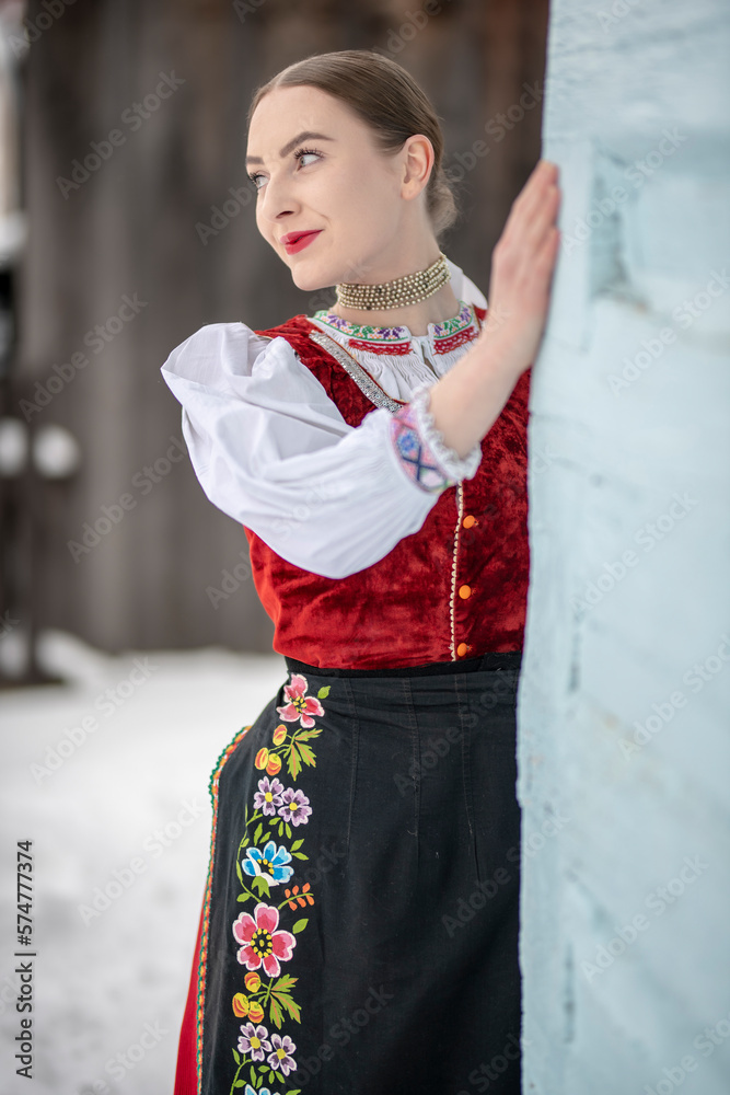 Young beautiful slovak woman in traditional costume. Slovak folklore