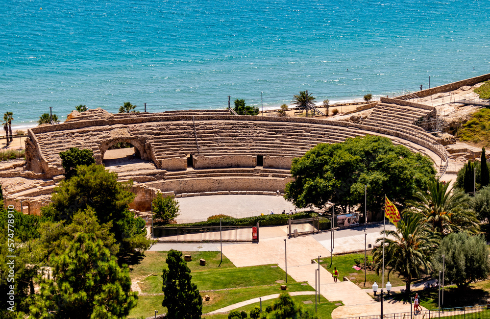 Roman amphitheater of Tarragona with the Mediterranean sea in the background