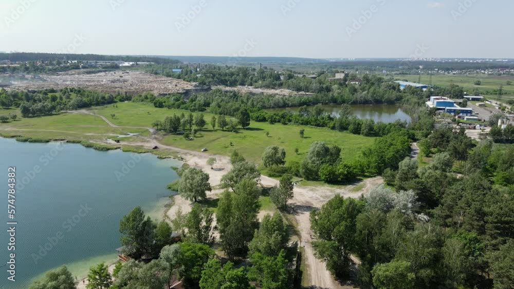 Drone fly of amazing summer view of Ukrainian village before the war. blue lake and green forests. Fresh water in Summer. Drone Flight Drone fly of amazing summer view of Ukrainian village before the war. blue lake and green forests. Fresh water in Summer. Drone Flight