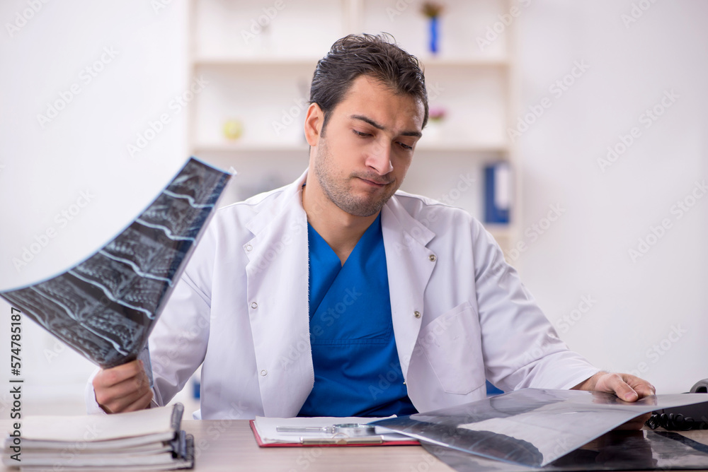 Fototapeta premium Young male doctor radiologist working in the clinic