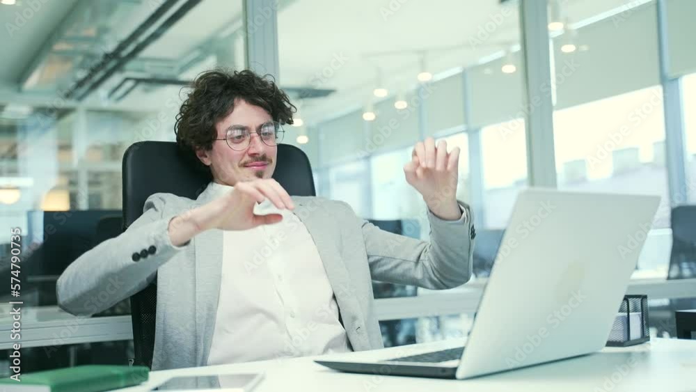 Smiling curly entrepreneur freelancer with hands behind head feels satisfied with work well done Calm bearded businessman relax after hard working day finished project on computer at modern workplace Smiling curly entrepreneur freelancer with hands behind head feels satisfied with work well done Calm bearded businessman relax after hard working day finished project on computer at modern workplace