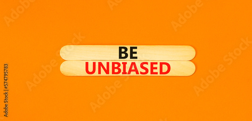 Be unbiased symbol. Concept words Be unbiased on wooden sticks. Beautiful orange table orange background. Business psychology be unbiased concept. Copy space. photo