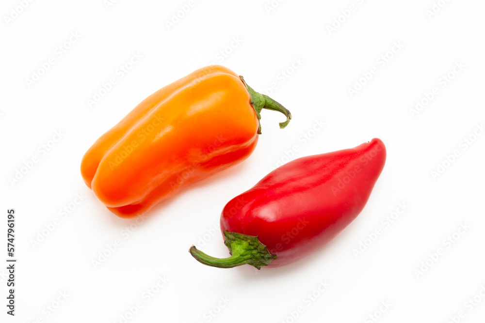 Red and yellow chili peppers on a white background