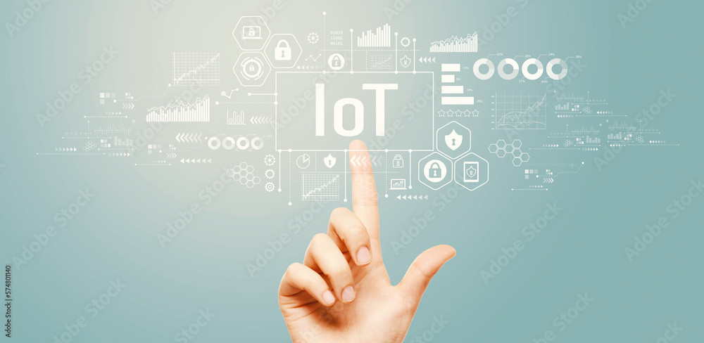 IoT theme with hand pressing a button on a technology screen IoT theme with hand pressing a button on a technology screen