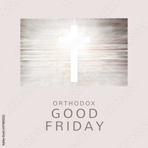 Composite of orthodox good friday text and illuminating cross on wooden table