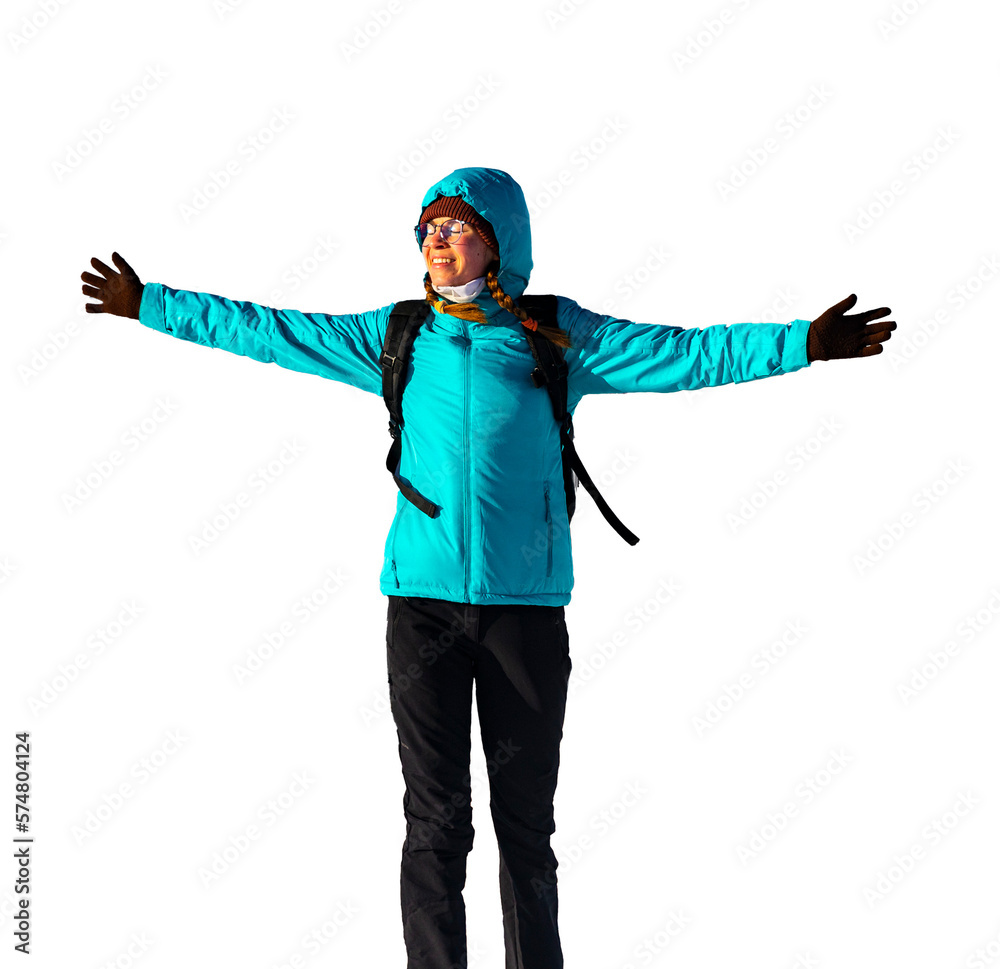 girl in thick jacket, cap and gloves spreads her hands with joy after reaching the top of the mountain, celebrating hiker girl in jacket isolated on transparent background