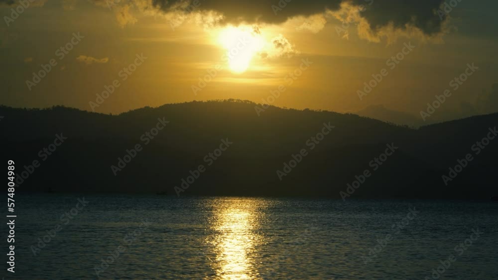 A quiet evening during sunset with a calm sea A quiet evening during sunset with a calm sea
