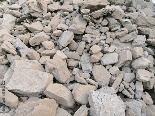 Gravel background, grey slate stone wall textured background close-up