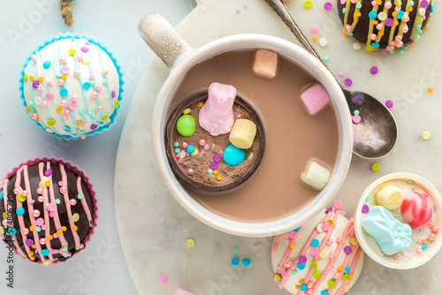 A look into a mug of hot cocoa with a hot cocoa bomb filled with confections.