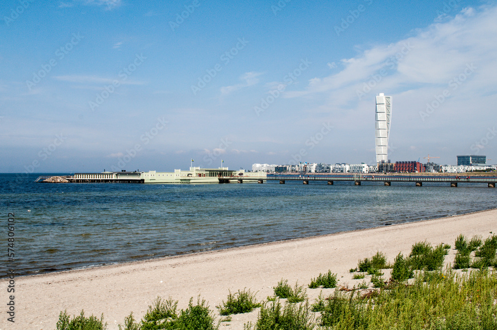 Sea coast with sandy beach and view of Malmo city, Sweden