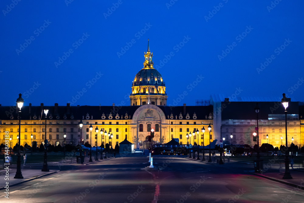 Illuminated Church Dome Of Les Invalides In The Night In Paris, France