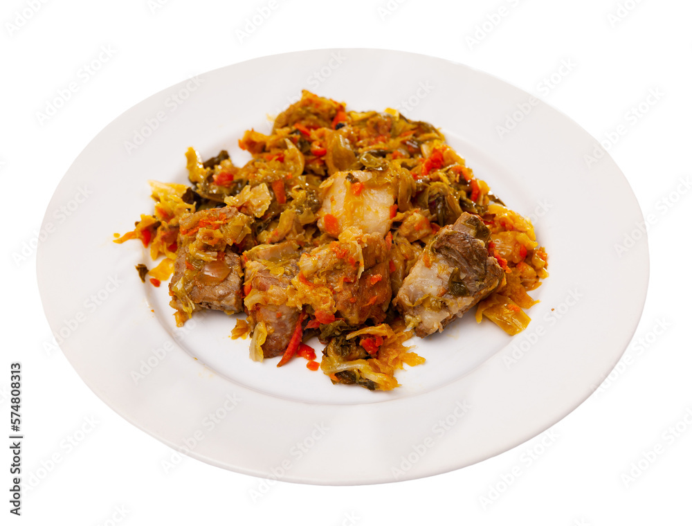 Cabbage stew with smoked pork ribs served in plate. Isolated over white background