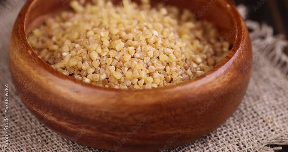 Pour and serve raw wheat porridge, crushed wheat grain for cooking porridge Pour and serve raw wheat porridge, crushed wheat grain for cooking porridge