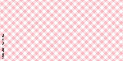 Seamless diagonal gingham checker pattern in pastel pink and white. Contemporary light barbiecore linen textured diamond background. Baby girl's trendy striped checks textile or nursery wallpaper. photo