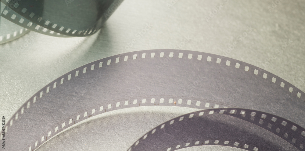 cinema background with film strip on gray background